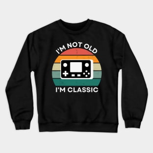 I'm not old, I'm Classic | Handheld Console | Retro Hardware | Vintage Sunset | '80s '90s Video Gaming Crewneck Sweatshirt